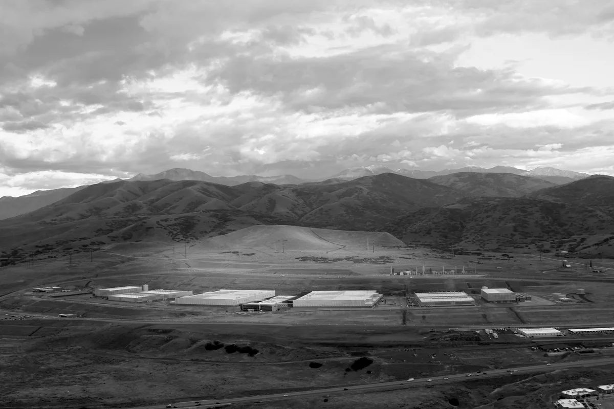 Aerial view of a large data centre complex among the hills