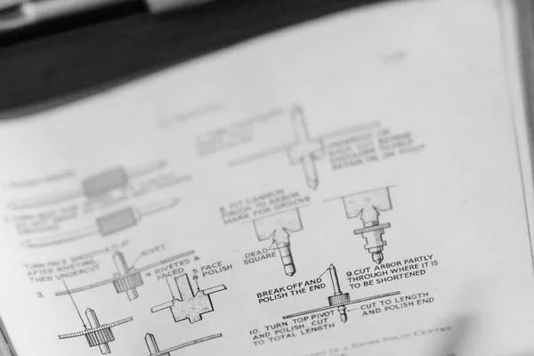 Page of an open technical manual, with numbered drawings of the machining stages of a pivot and a caption for each step, in black and white