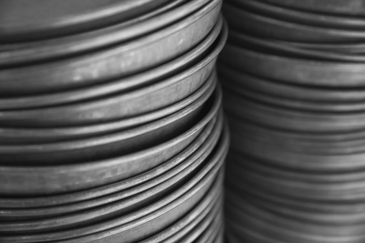 Two stacks of plain metal discs seen edge-on, no figures and no engraving on any surface, black and white photograph